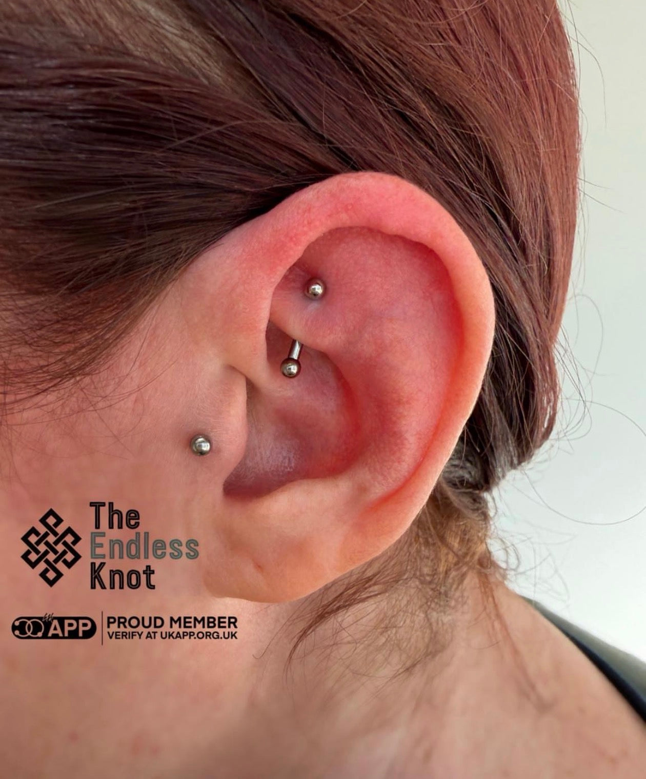 Curved barbell in ear