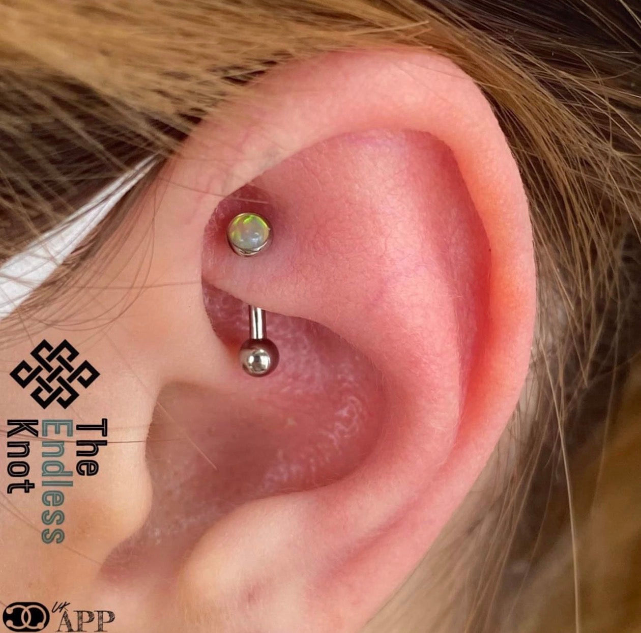 Curved barbell in ear