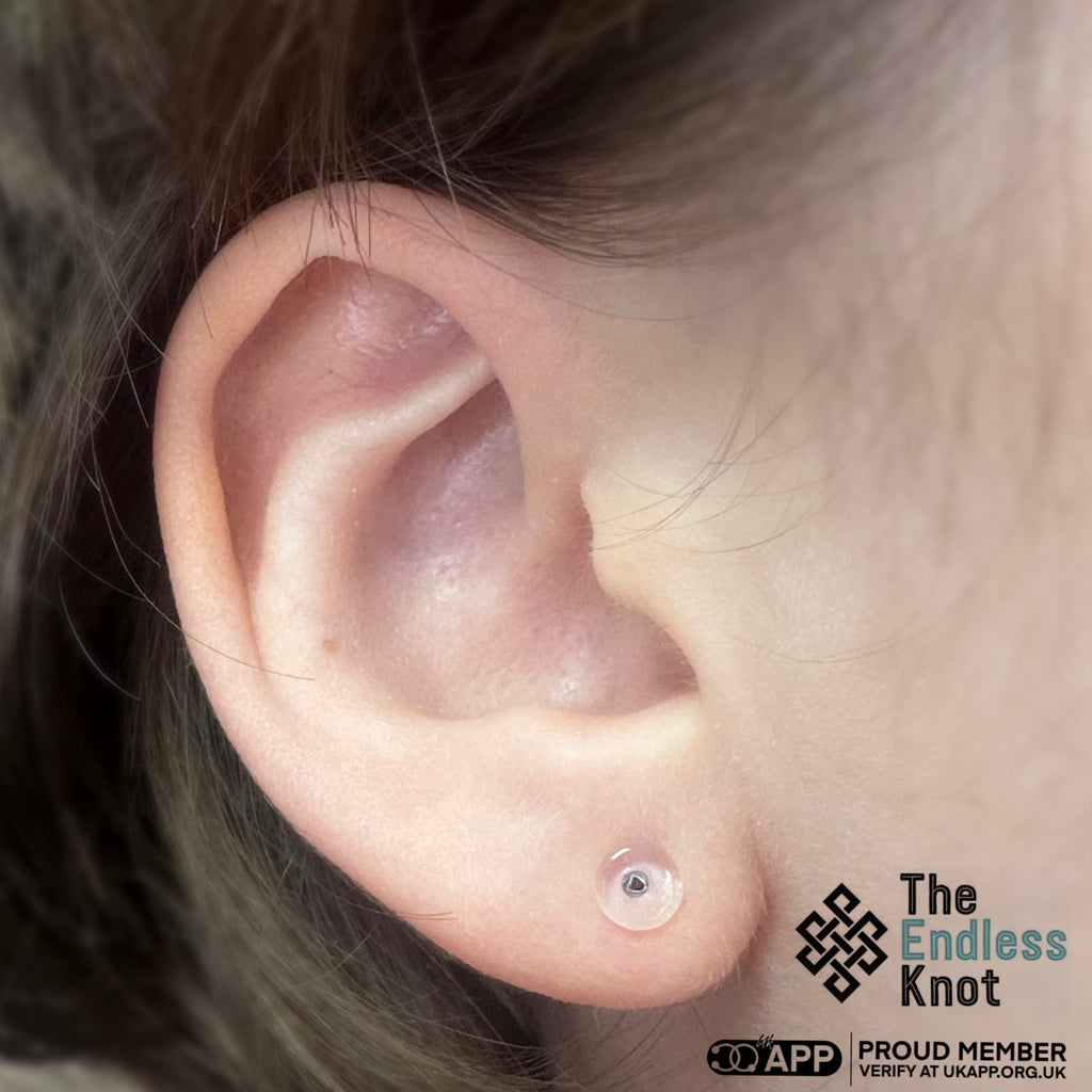 Glas labret (behoudstuk)
